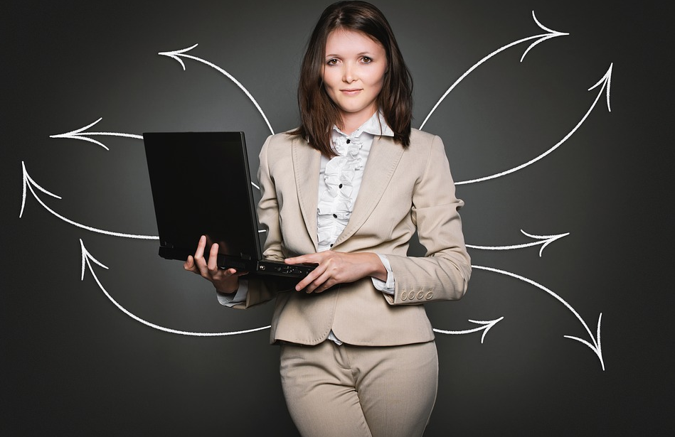 girl in a suit with a laptop